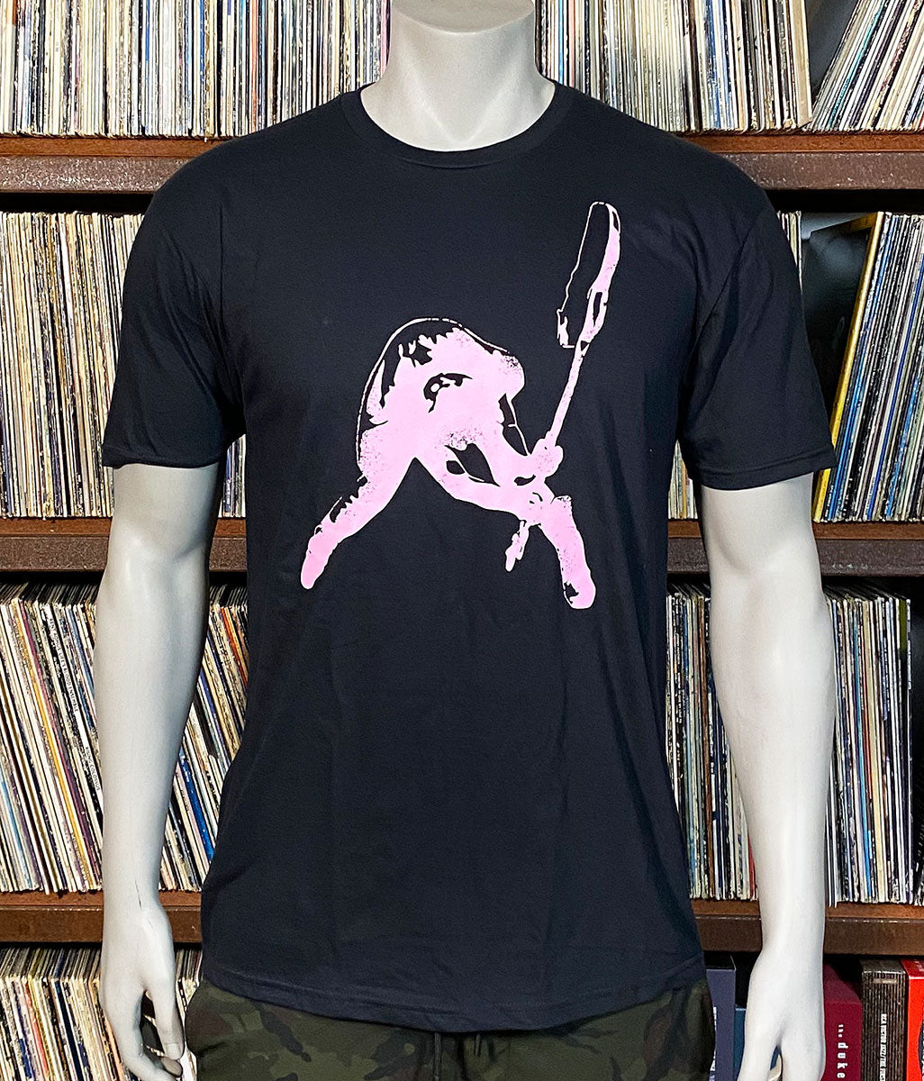 Black t-shirt with pink graphic of a cat playing a guitar on a mannequin against a background of records.